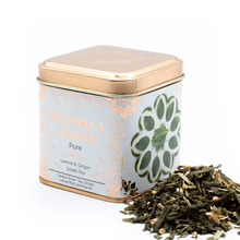 Load image into Gallery viewer, Artisan tea blends in metal tins. Tea canister with 'Mandala Leaves' branding and green tea leaves spilling out 