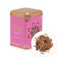 Load image into Gallery viewer, Loose leaf tea stored in premium tins. Pink tea canister labeled 'Mandala Leaves' with a small pile of tea leaves 