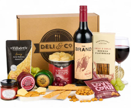 Gourmet cheese and wine gift hamper with savoury treats and crackers