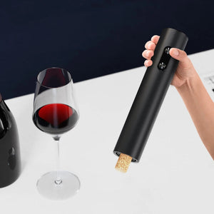 Battery-powered wine opener with foil cutter and pourer