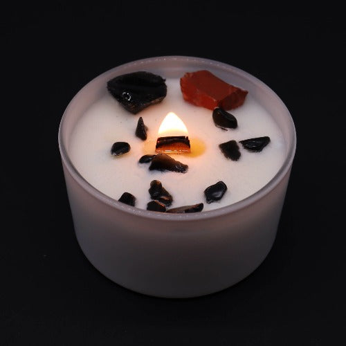 Crystal healing candle with gemstones for meditation and reiki