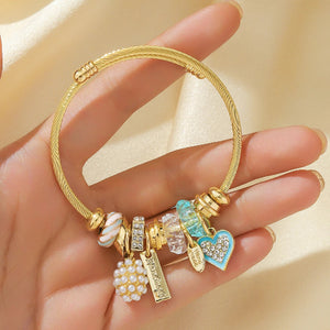 Gold bracelet with various charms 