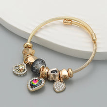 Load image into Gallery viewer, Gold bracelet with various charms, beaded bracelet