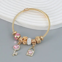 Load image into Gallery viewer, Gold circle charm bracelet with key, love theme