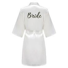 Load image into Gallery viewer, Satin bridal party robes laid out with personalized embroidery