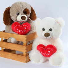 Load image into Gallery viewer, Soft stuffed dog toy holding a heart for romantic Valentine’s Day surprise