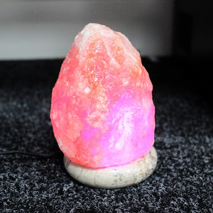 Warm glowing pink salt lamp for cozy atmosphere
