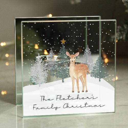 Festive glass candle holder with engraved reindeer design