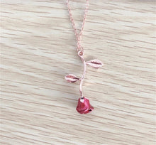 Load image into Gallery viewer, Gold and silver rose necklace with a vibrant red flower charm, designed as a meaningful gift for her.