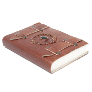 Classic vintage leather-bound journal with strap
