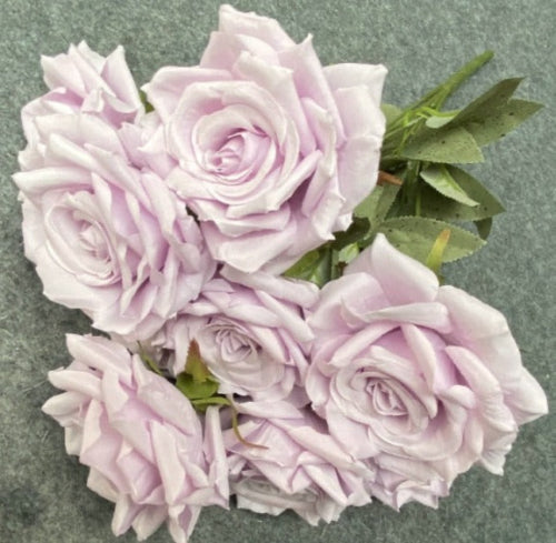 Stunning faux rose arrangement with rhinestone embellishments.