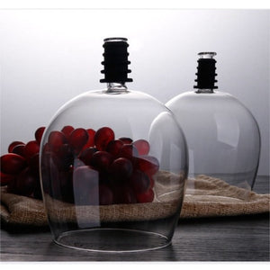 large red wine glasses-how to hold a wine glass-stemless wine glasses-drinking glasses made from bottles-drinking from glass bottles-drink wine from the bottle-drinking glass with a lid