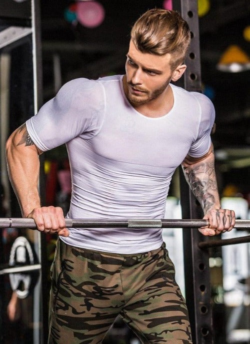 A black men’s compression vest designed to slim the torso and support posture, worn under clothing for a smooth, fitted appearance.