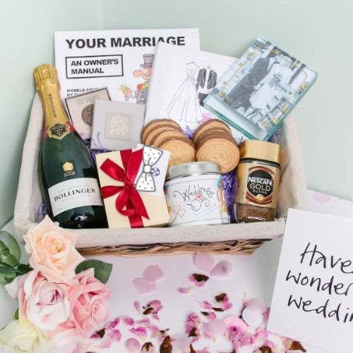 Wedding gift basket filled with treats and personalised card for bride and groom